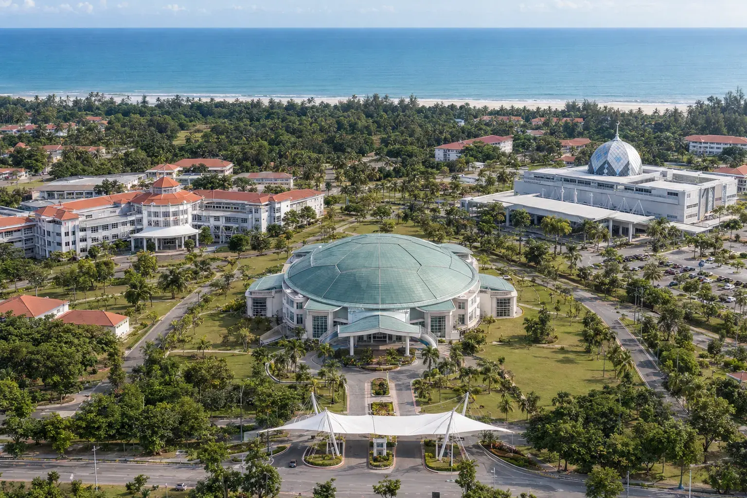 Illustrated aerial view of Universiti Malaysia Terengganu: the turtle-shaped main hall, with the beach and the South China Sea behind.